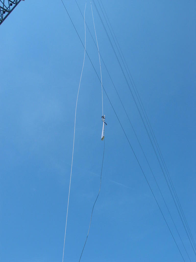 The sensor boom is pulled up the tower with a rope