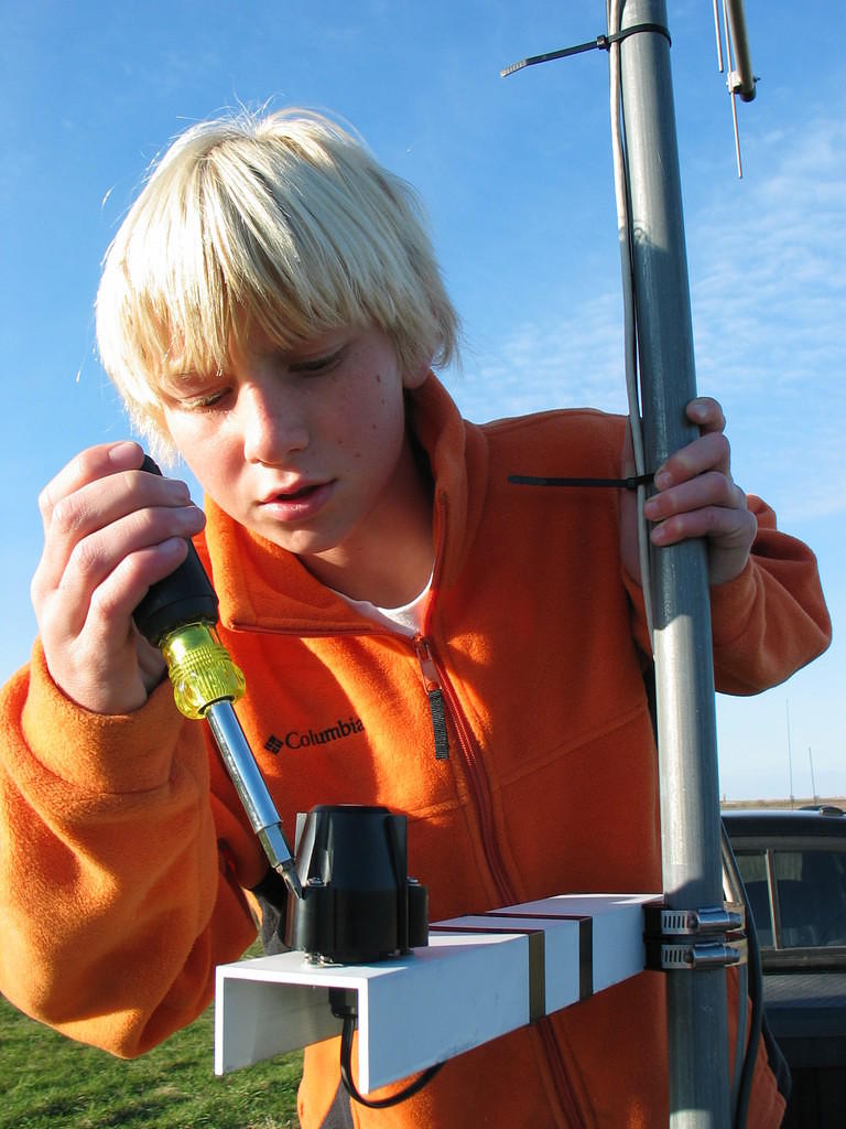 Kobi Dansingburg levels the Davis solar radiation sensor at the Wiscoy weather station test site