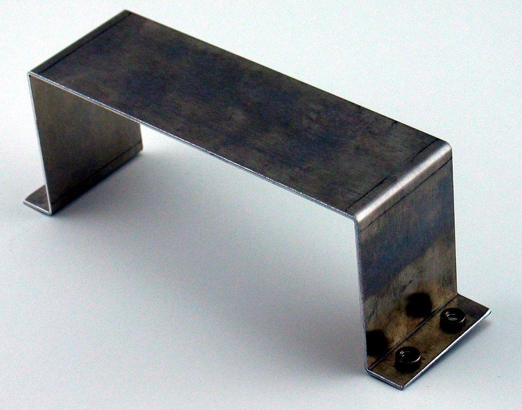 Bracket for attaching a 7 amp/hour sealed battery (NP7-12 or similar) to a flat surface. There are four captive #10-24 nuts.