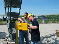 Jim shows Patrick of Tower Tech the data logger installation steps