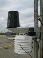 Rain gauge, solar radiation shield with temperature and relative humidity, and solar radiation sensor