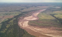 Red River after a recent flood, en route to a crane work site