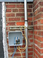 Junction box mounted to the building facade - lots of room for wiring